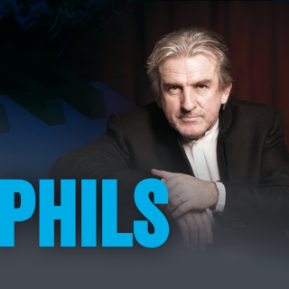 Barry Douglas looks at the camera with the word PHILS in blue all caps in the foreground.